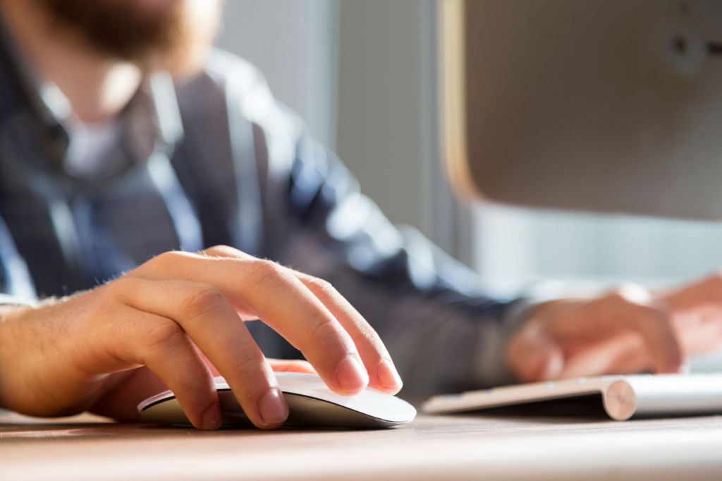 Image of a person using a computer mouse